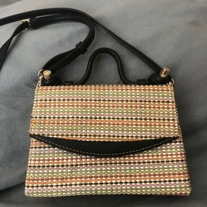 Brand new small multi colored shoulder/hand bag.